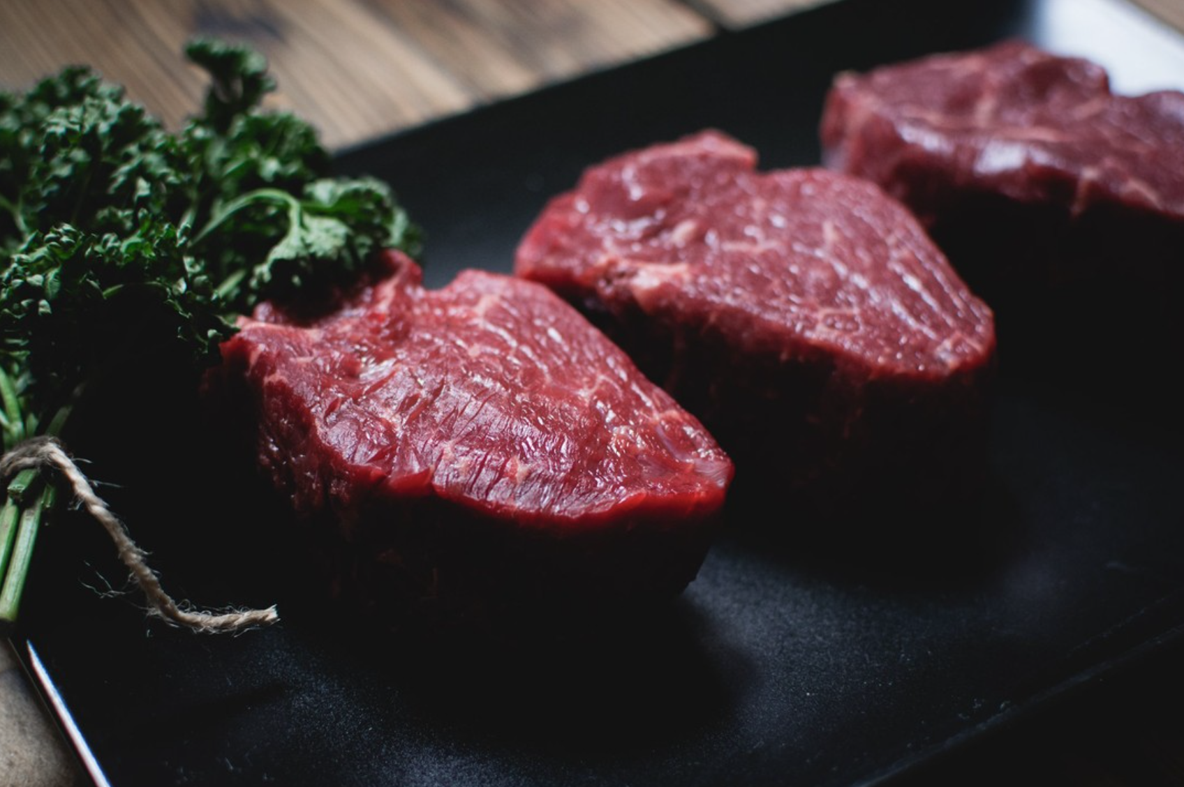 Dry-aged bone-in ribeye prepared by our Australian butchers